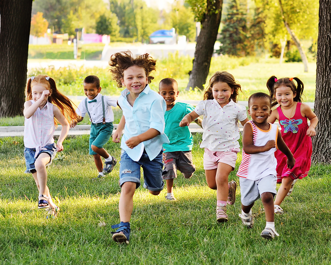 Young children running together. Project L.E.A.P child care